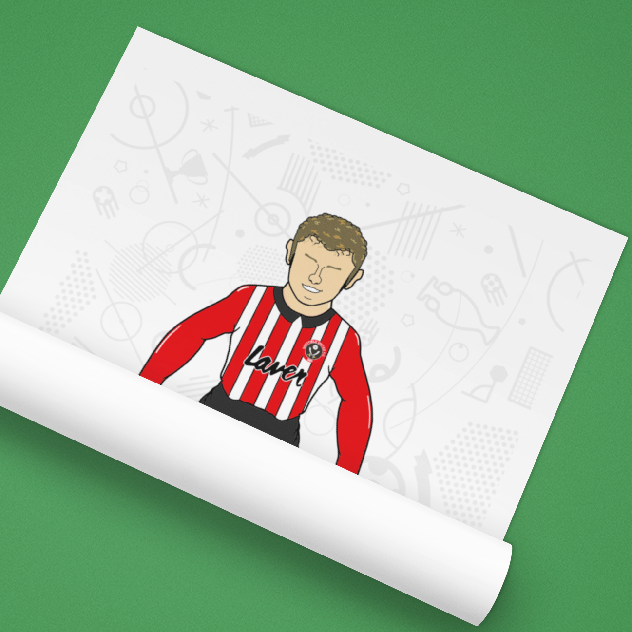 Roll of paper with a printed design of a person wearing a red and black striped shirt on a green background